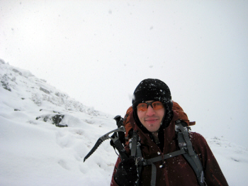 Black bomber hat in Adirondack snow storm